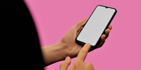 Hand holding smartphone on pink background, ideal for vibrant app displays