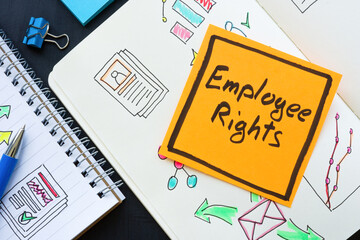 Note Employee rights and open notebooks with notes.