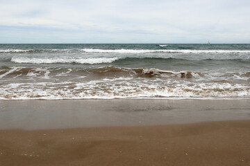 Mediterranean Sea. Beautiful clean sand and sea foam.