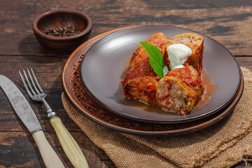 Cabbage rolls stuffed with rice and meat stewed in tomato sauce. Traditional dish, ready-to-eat food