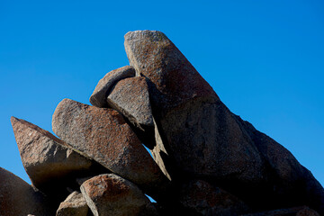 Symbolic natural granite stone sculpture in the natural park of the Australian island.