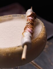 Cocktail with sugar rim and roasted marshmallows