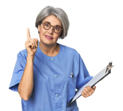 Caucasian mid-age nurse holding report having an idea, inspiration concept. - Powered by Adobe