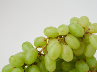 Green grape with leaves isolated on white. With clipping path.