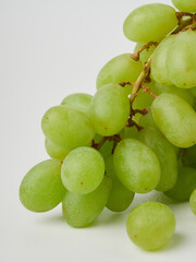 Green grape with leaves isolated on white. With clipping path.