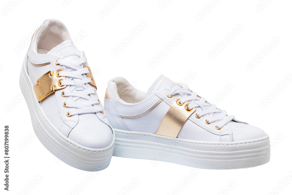 Wall mural white sneaker isolated. close-up of a pair white elegant stylish female leather high-heeled sport sh