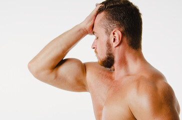 Naklejka premium Handsome man with an athletic body. Fitness and healthy lifestyle.