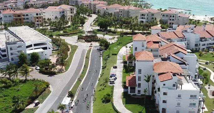 drone shot flying over beautiful residential summer resort of punta cana, dominican republic