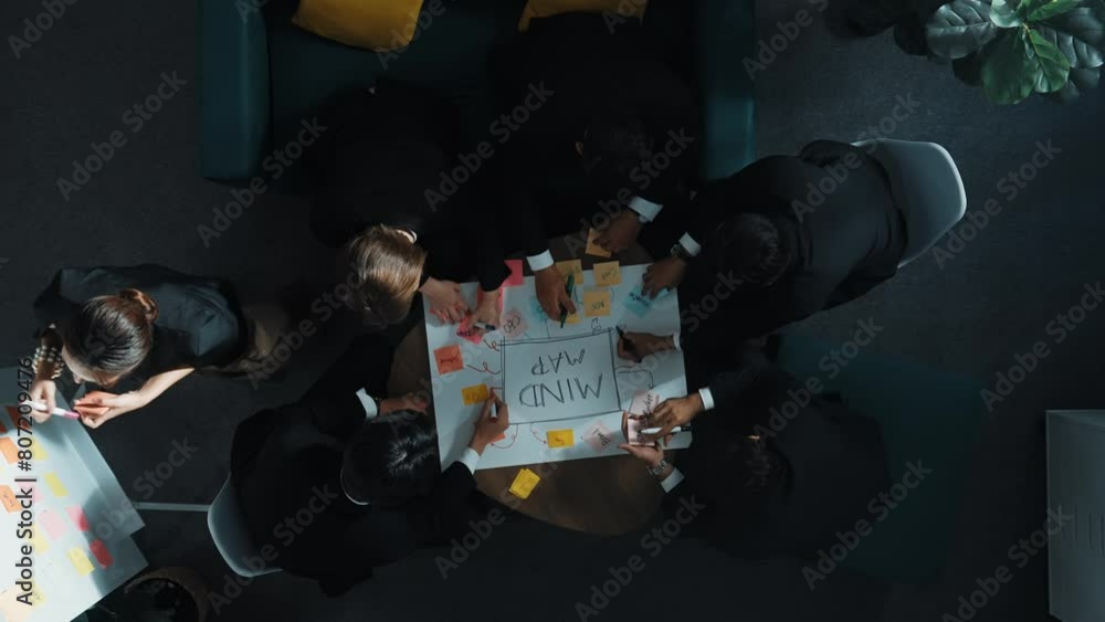 Aufkleber top down aerial view of group of smart diverse business people brainstorm marketing idea while writi