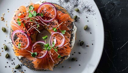 Healthy smoked salmon on sesame seed bagel with cream cheese red onion sprouts capers on white plate with black background in flat lay composition
