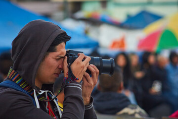 Photographer in the middle of a cultural event