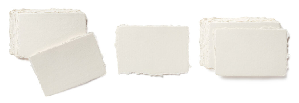 set of blank deckle edged handmade paper business cards, single and in stacks, isolated over a transparent background, cut-out luxury stationery, branding or business mockups, top view / flat lay, PNG