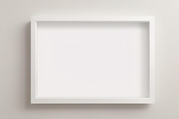 Fototapeta premium Minimales, leeres, quadratisches Bild mit weißem Rahmen, das auf einem weißen Wandhintergrund mit Fensterlicht und Schatten hängt. Bild isolieren