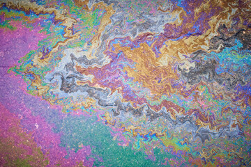 Marble spills on water from gasoline and oil stains. Abstract background from spilled motor oil,...