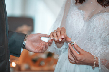 wedding ceremony, the bride and groom wear wedding rings