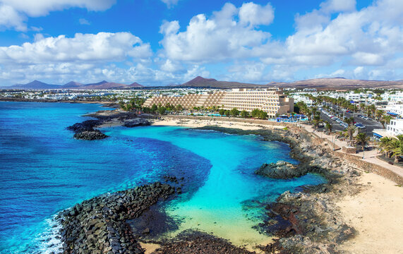 Aerial view of the famous El Jablillo beach resort on the Atlantic Coast of Lanzarote island with its blue crystal clear waters in the summer season.