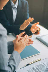 Business people clapping and applause at meeting or conference, close-up of hands. Group of unknown businessmen and women in modern white office. Success teamwork or corporate coaching concept