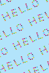 Creative letters - hello on a blue background.  Candy summer concept with copy space.