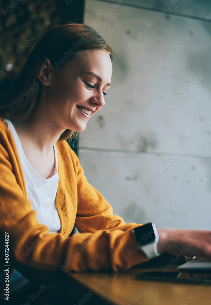 Poster happy woman laughing from messaging with friend in social network browsing wireless internet on lapt