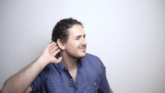 Deaf person points to ear because of hearing problem