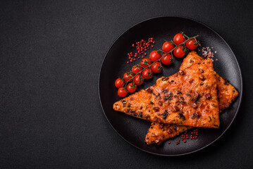 Slices of delicious street pizza with sausage, mushrooms, tomatoes and cheese