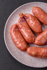 Baked chicken or pork sausages, salt, spices and herbs