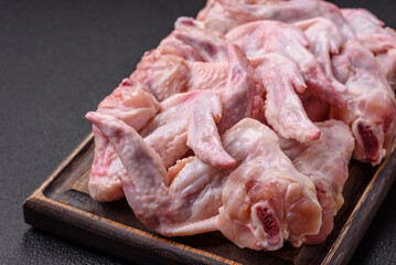 Fresh chicken wings with salt, spices and herbs