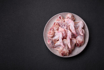 Fresh chicken wings with salt, spices and herbs