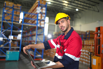 Warehouse worker working in warehouse storage. Foreman or worker work at factory site check up...