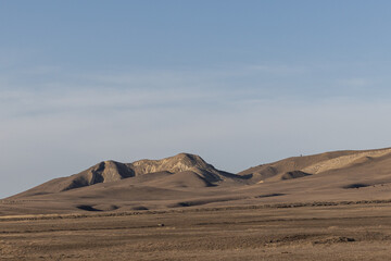 Majestic Desert Fortress: A Mountain Range Rises in Solitude