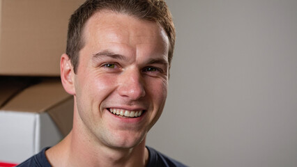 Obraz premium Empowering Smiles: The Journey of a Dedicated White Male Deliveryman, a Model of Hard Work and Happiness