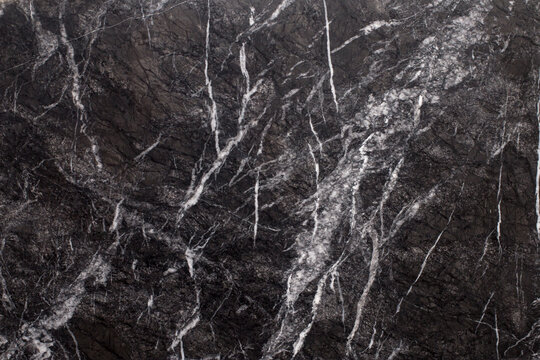 Close up of black marbling texture. High resolution photo.Nice background for design projects. Grigio Carnico marble