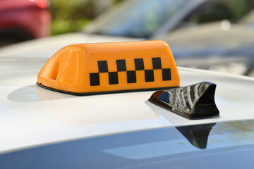 Information box with checkers on the roof of a taxi in Russia