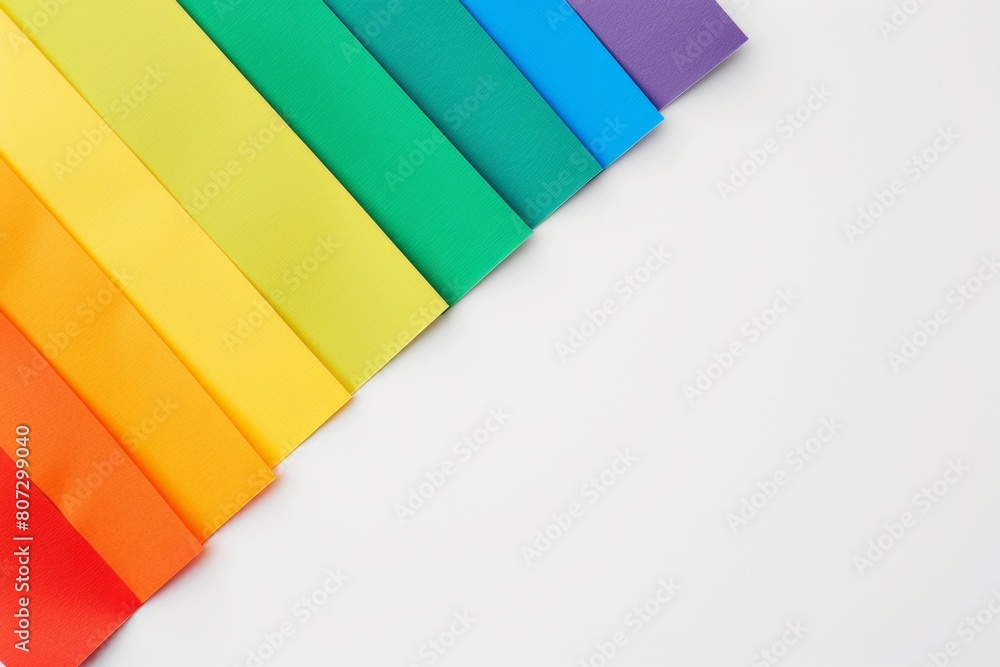 Poster rainbow colored paper on a white background with copy space, in the style of pride flag colors gener