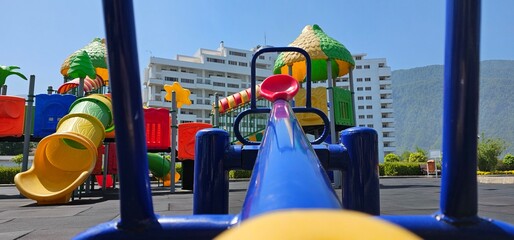 Colorful Playground with Swings and Slide