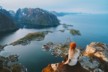 Woman tourist traveling in Norway active summer vacations adventure lifestyle outdoor in Lofoten...