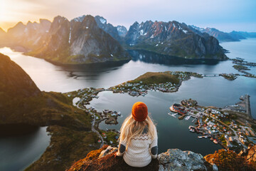 Woman hiking in Lofoten islands travel lifestyle in Norway, girl enjoying aerial view from...