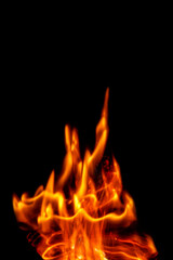Fire flames isolated on a black backdrop. Abstract fire background.