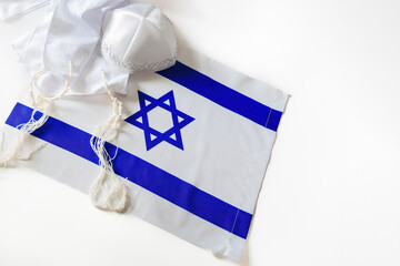 Jewish holiday of Israeli Independence Day. Flag of Israel, characterized by blue stripes and a...