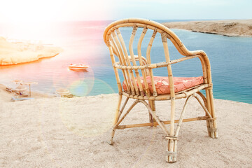 Stylishly beautiful chair on the sea nature landscape background