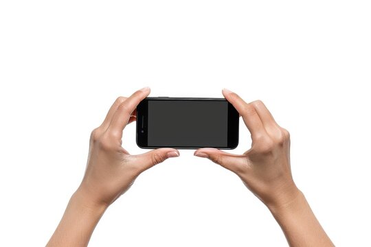 Person holding Phone horizontally in both hands on white background. Smartphone in hand for taking
