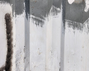 The texture of a gray-colored profiled sheet or corrugated metal sheet as an abstract background.