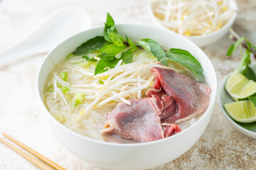 pho bo, vietnamese raw beef and rice noodle shoup