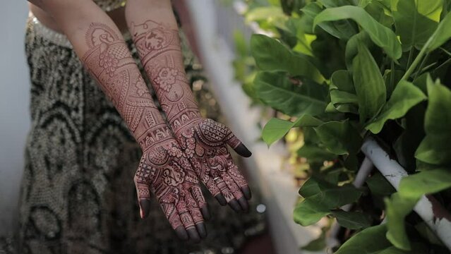 mehandi on hands indian ritual bride