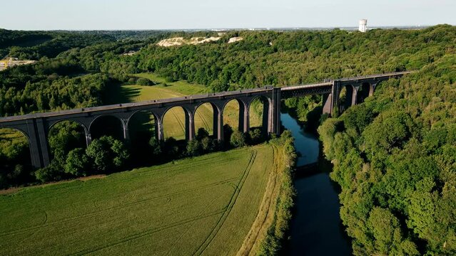 A drone view of the Conisbrough Viaduct and the girder span over the River Don at Conisbrough, Yorkshire, UK in summer time