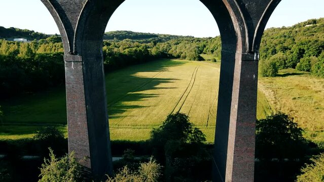 A drone view of the Conisbrough Viaduct and the girder span over the River Don at Conisbrough, Yorkshire, UK in summer time
