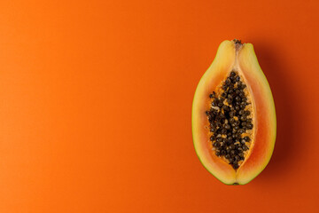 Papaya fruit on vivid background. Minimal abstract summer concept.