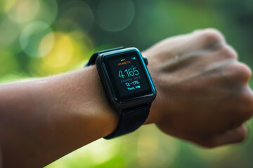 Modern Smartwatch Displaying Time and Weather on Male Wrist