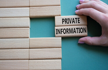 Private Information symbol. Wooden blocks with words Private Information. Beautiful grey green background. Businessman hand. Business and Private Information concept. Copy space.