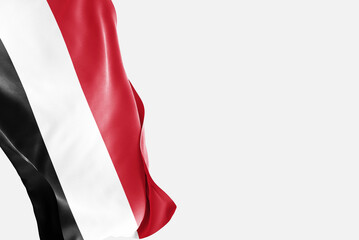 National flag of Yemen flutters in the wind. Wavy Yemen Flag. Close-up front view.